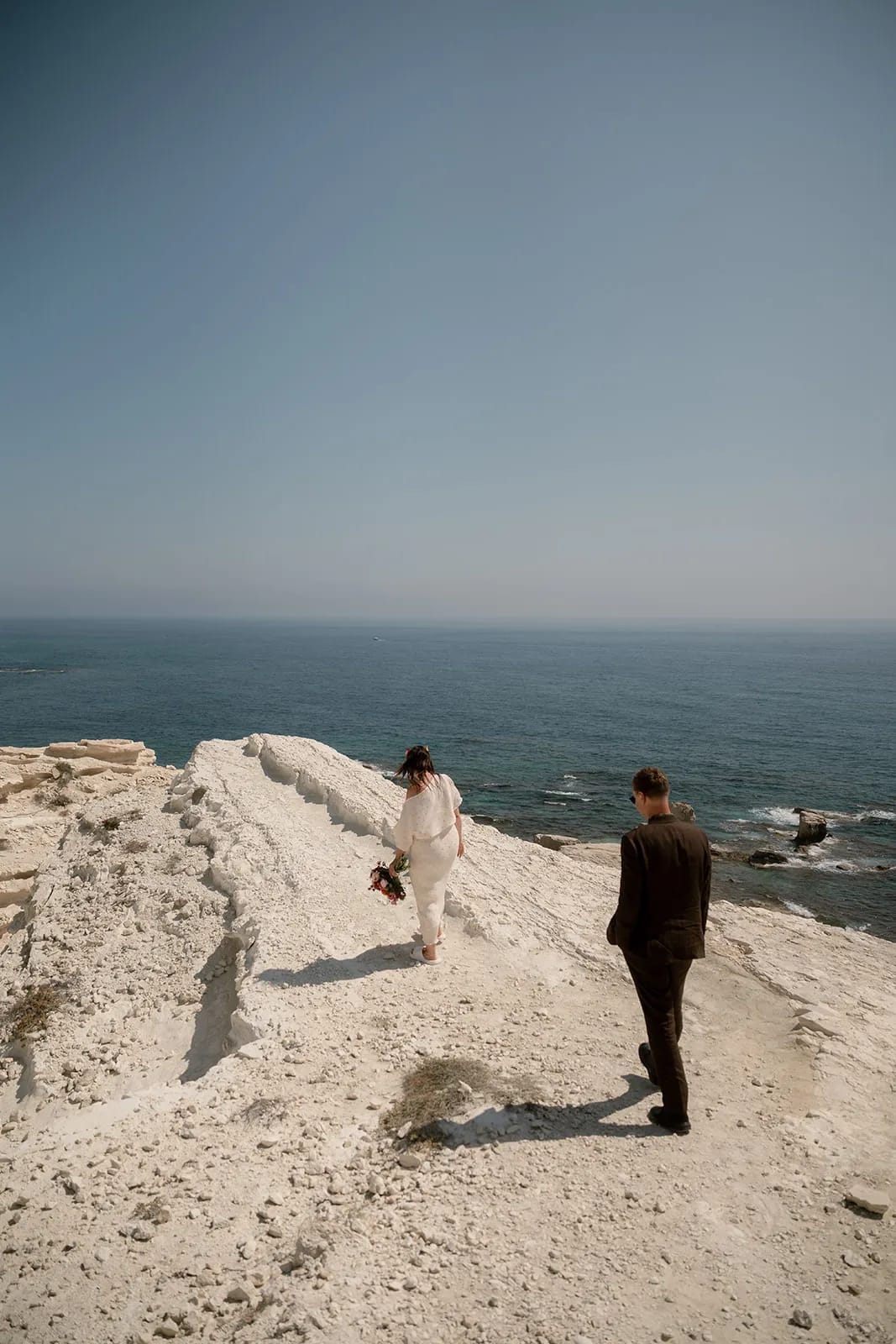 Couple on the Cyprus coastline during their wedding day