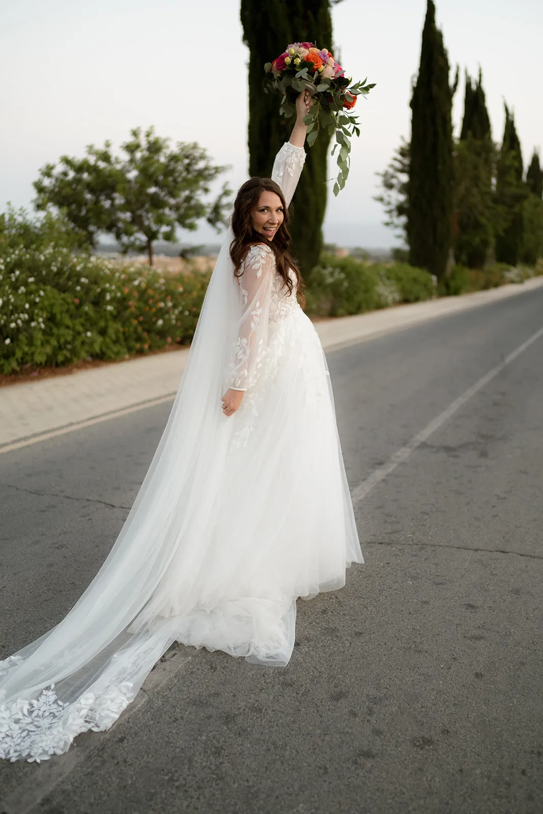Bride with bouquet on road