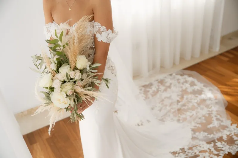 Couple portraits in resort gardens during their Cyprus wedding