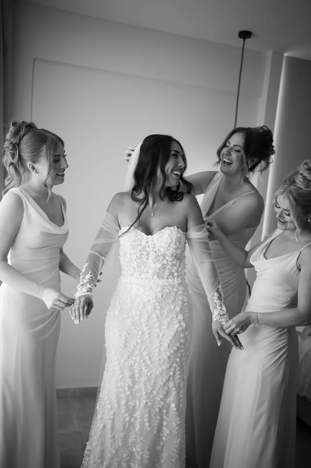 Bethanie laughing with her bridesmaids while getting ready in Paphos.