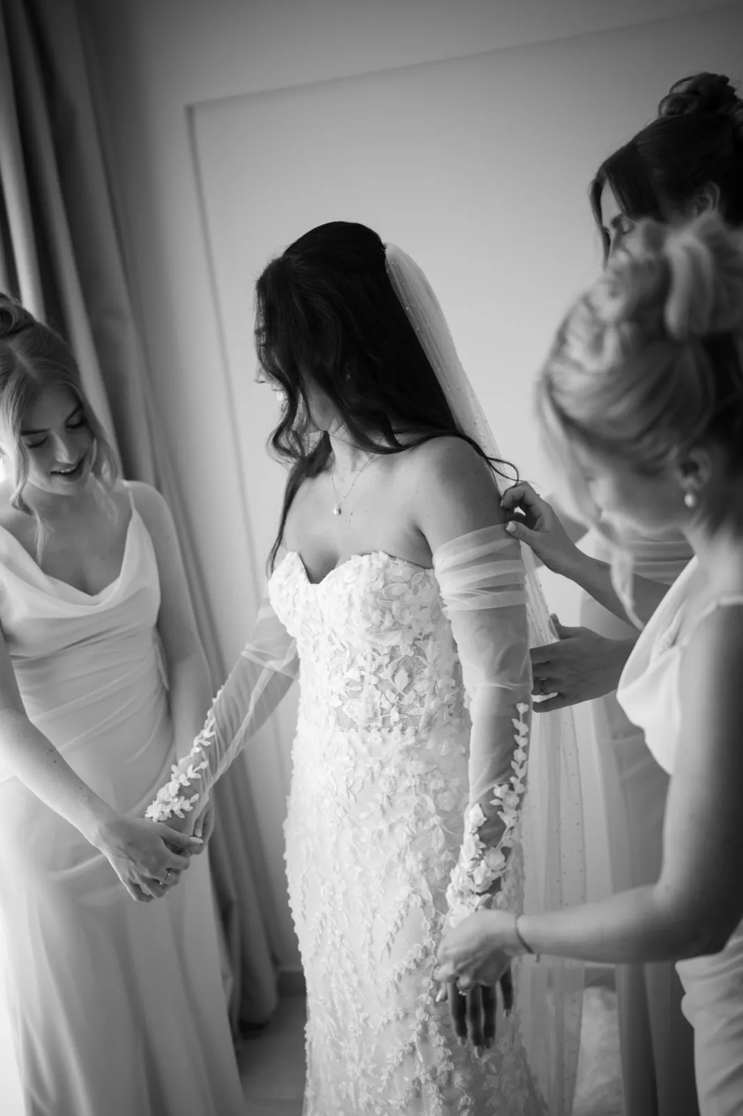 Bethanie having her wedding dress fastened by her bridesmaids during preparations in Paphos.