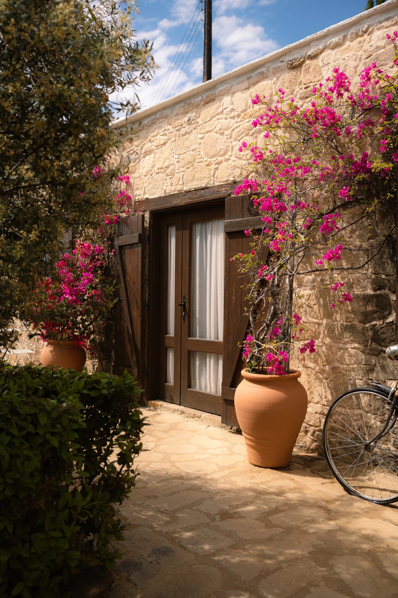 Bougainvillea archway and stone steps at Liopetro wedding venue, Kouklia, Paphos.