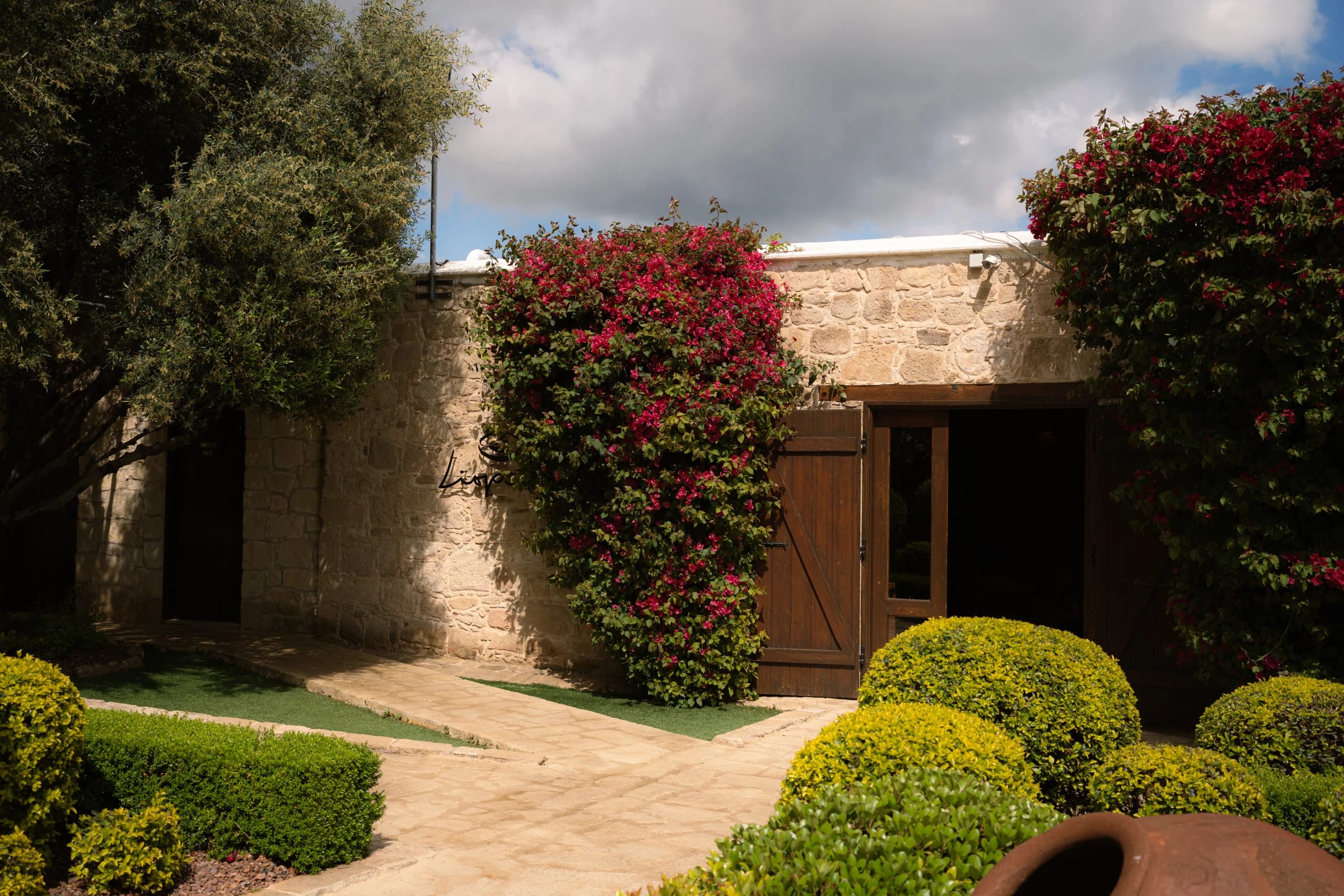 View across the Liopetro stone courtyard and surrounding countryside, Paphos, Cyprus.