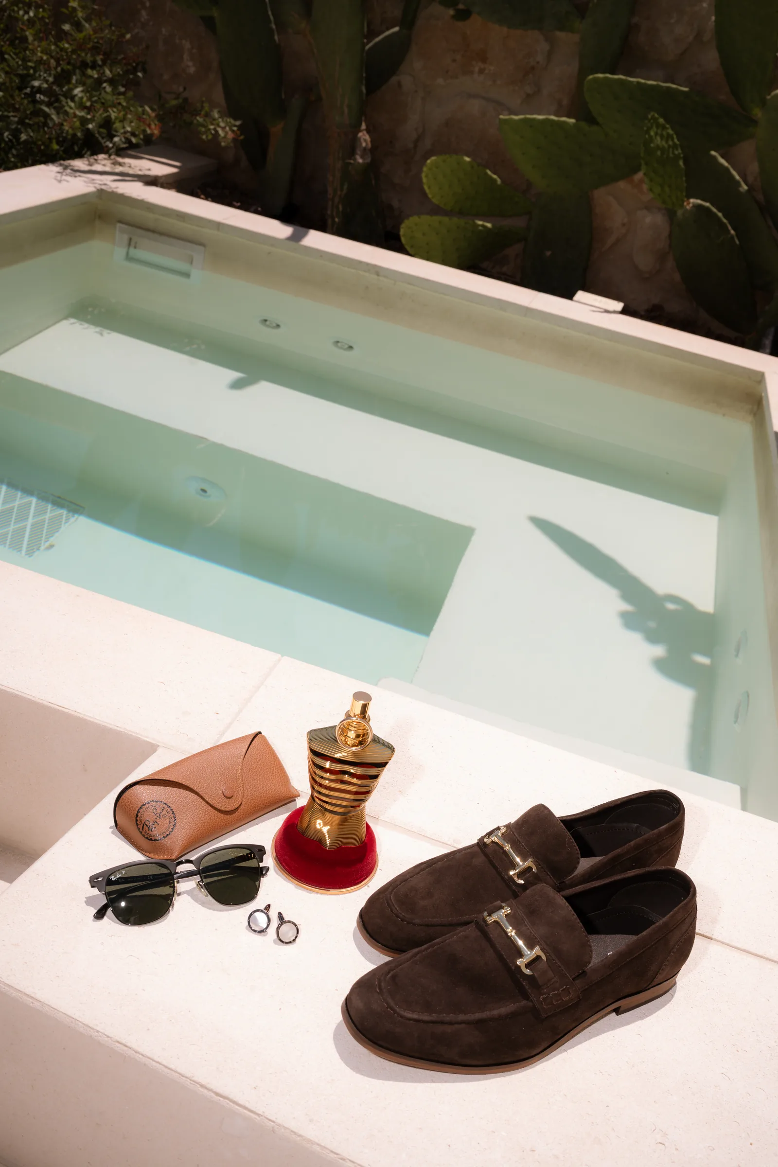 Groom's wedding details laid out by the villa pool before the Liopetro wedding, Kouklia, Paphos.