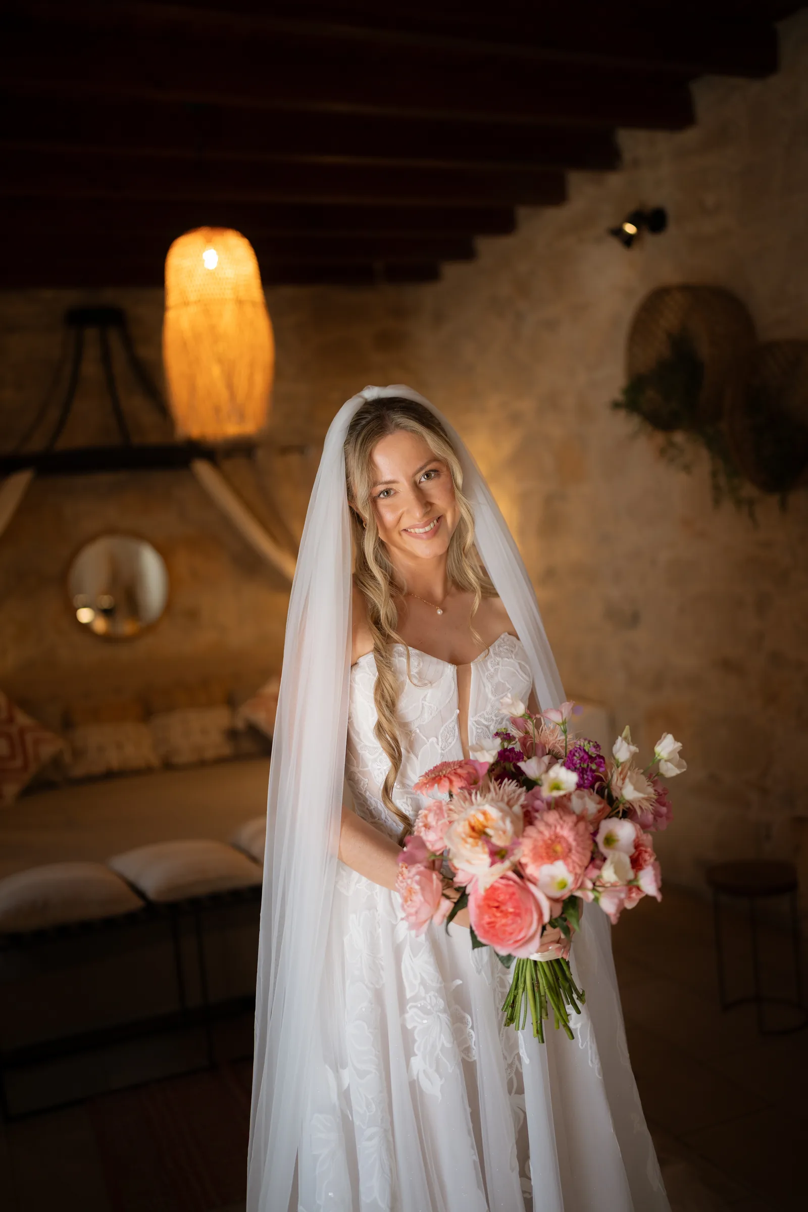 Soft bridal portrait of Franziska beneath her veil in the styled stone room at Liopetro, Kouklia, Paphos.
